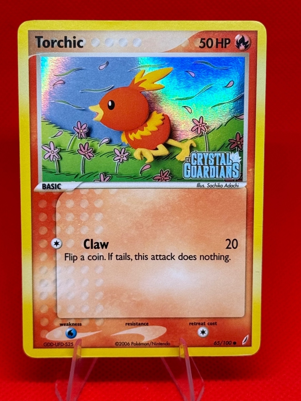 Torchic 65/100 EX Crystal Guardians Stamped Reverse Holo